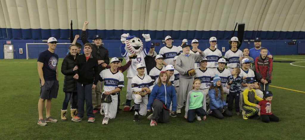 Blizzard Elite Baseball players with young kids at a Miracle League Summer Camp hosted by the JP4 Foundation