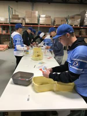 Blizzard Baseball players volunteering for the JP4 Foundation